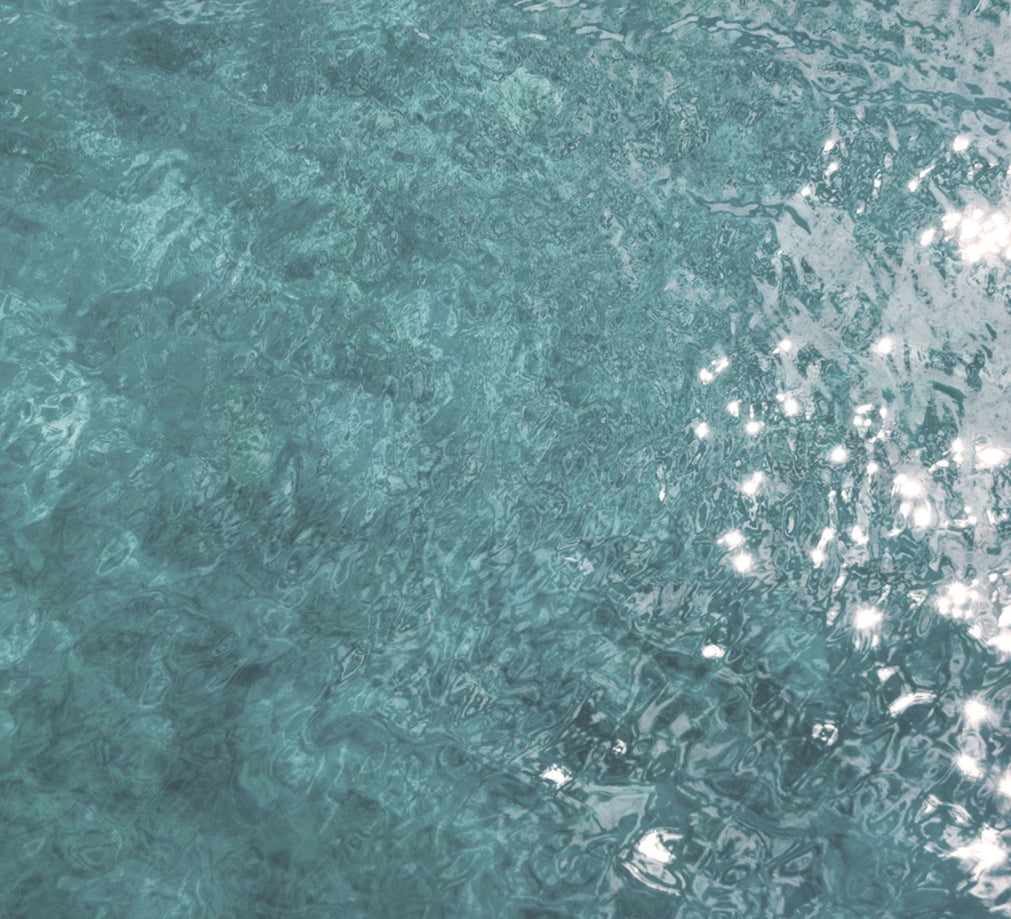 Close Up Of Clear Ocean Water Surface Glistening In The Sun | Dip &amp; Doze